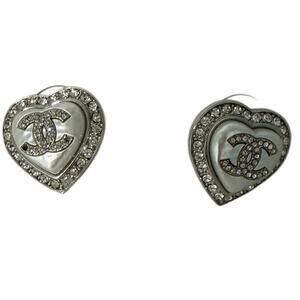 Chanel heart stud earrings with a pearly white or mother-of-pearl center